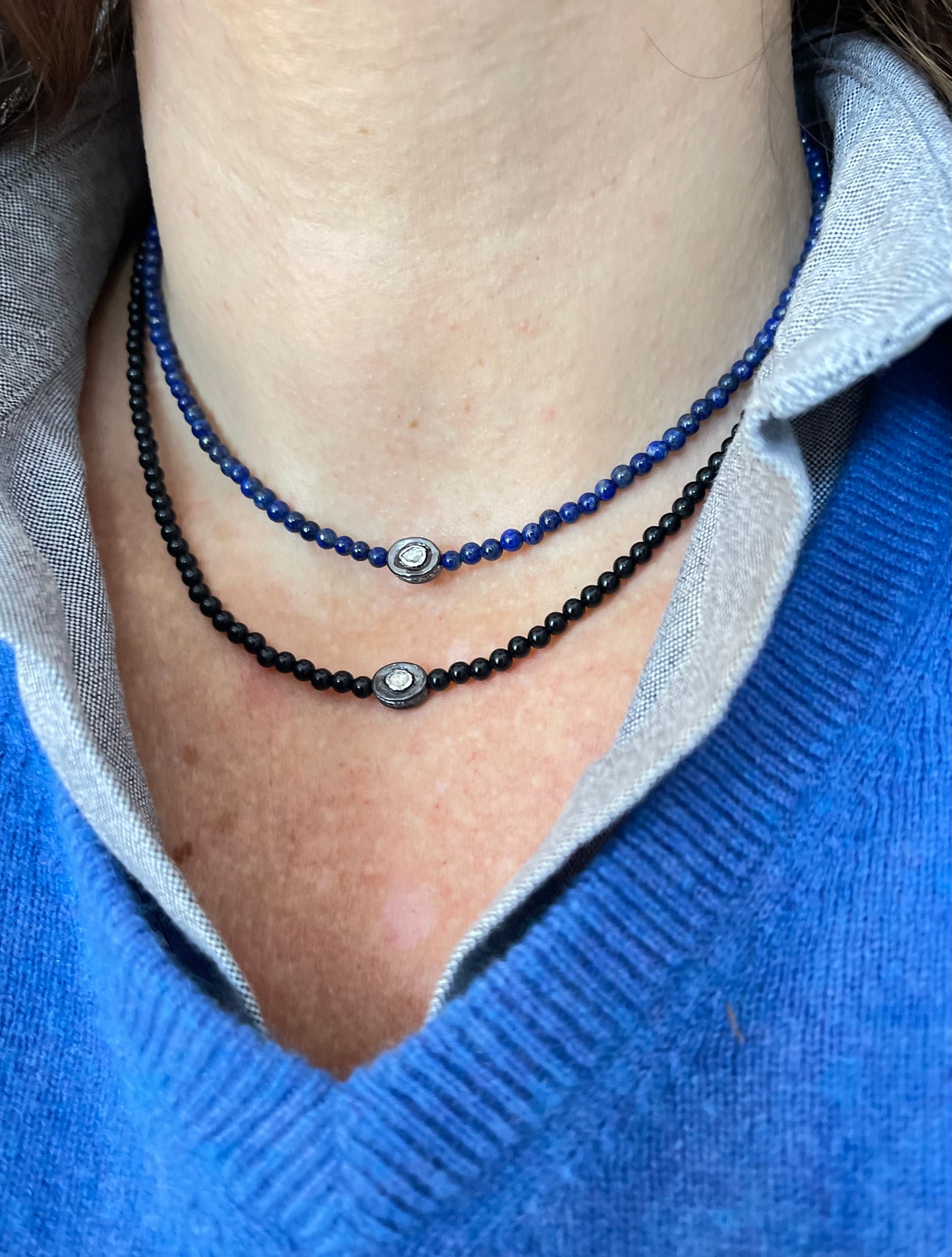 Necklace with an oxidized sterling silver pendant inset with a polki diamond